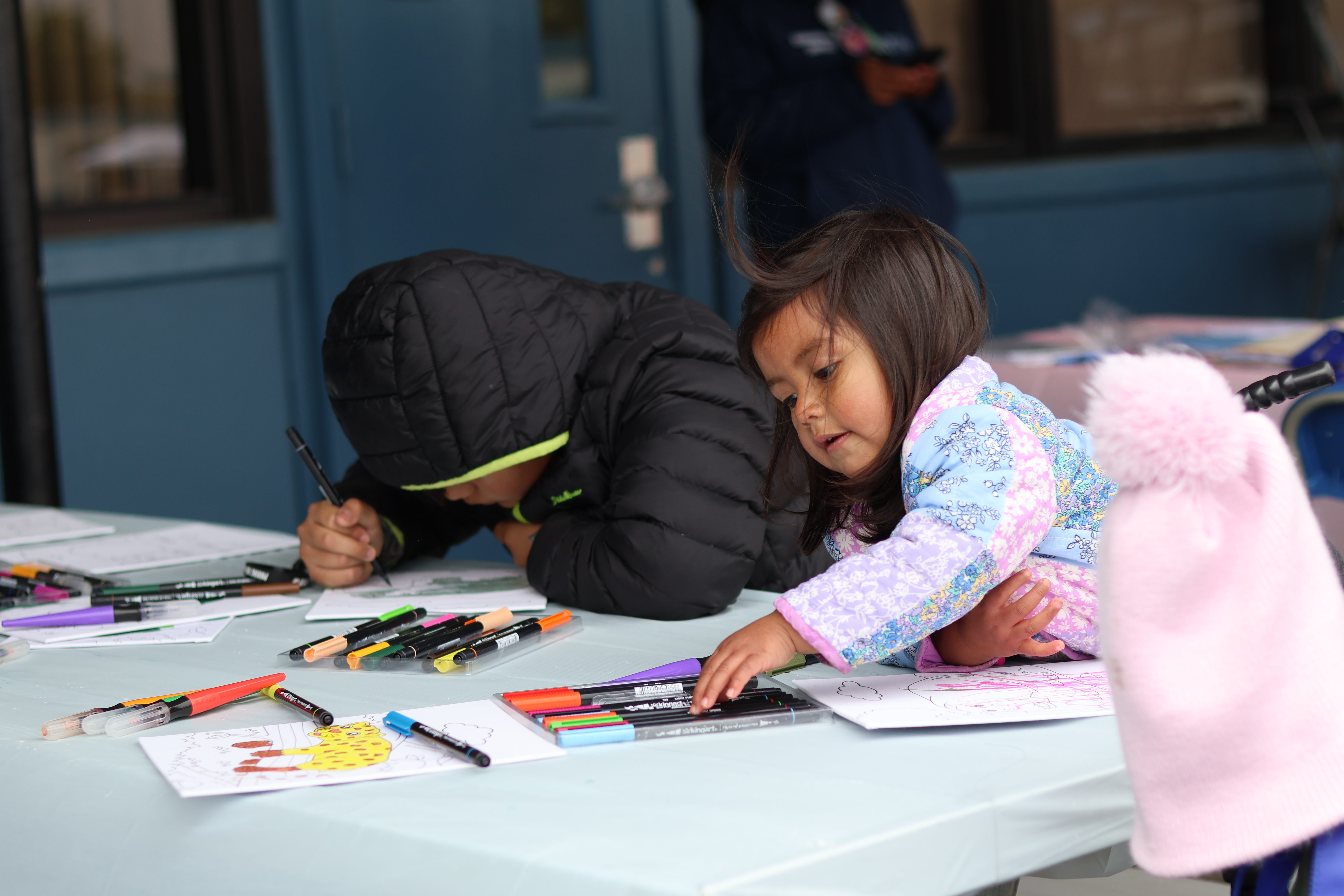 students coloring with markers